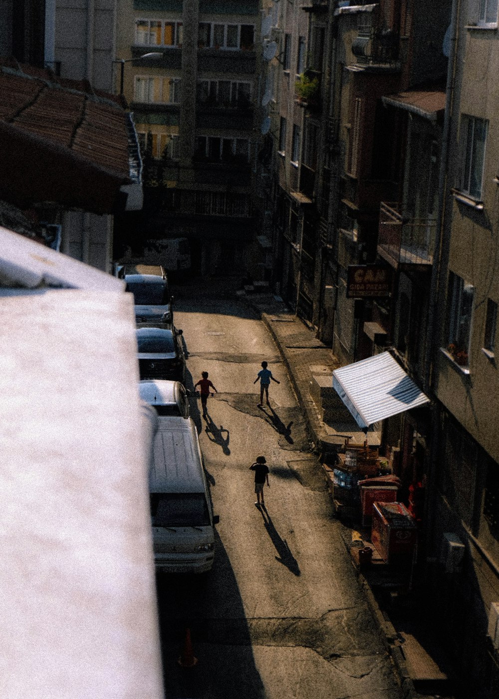 a street with cars and people