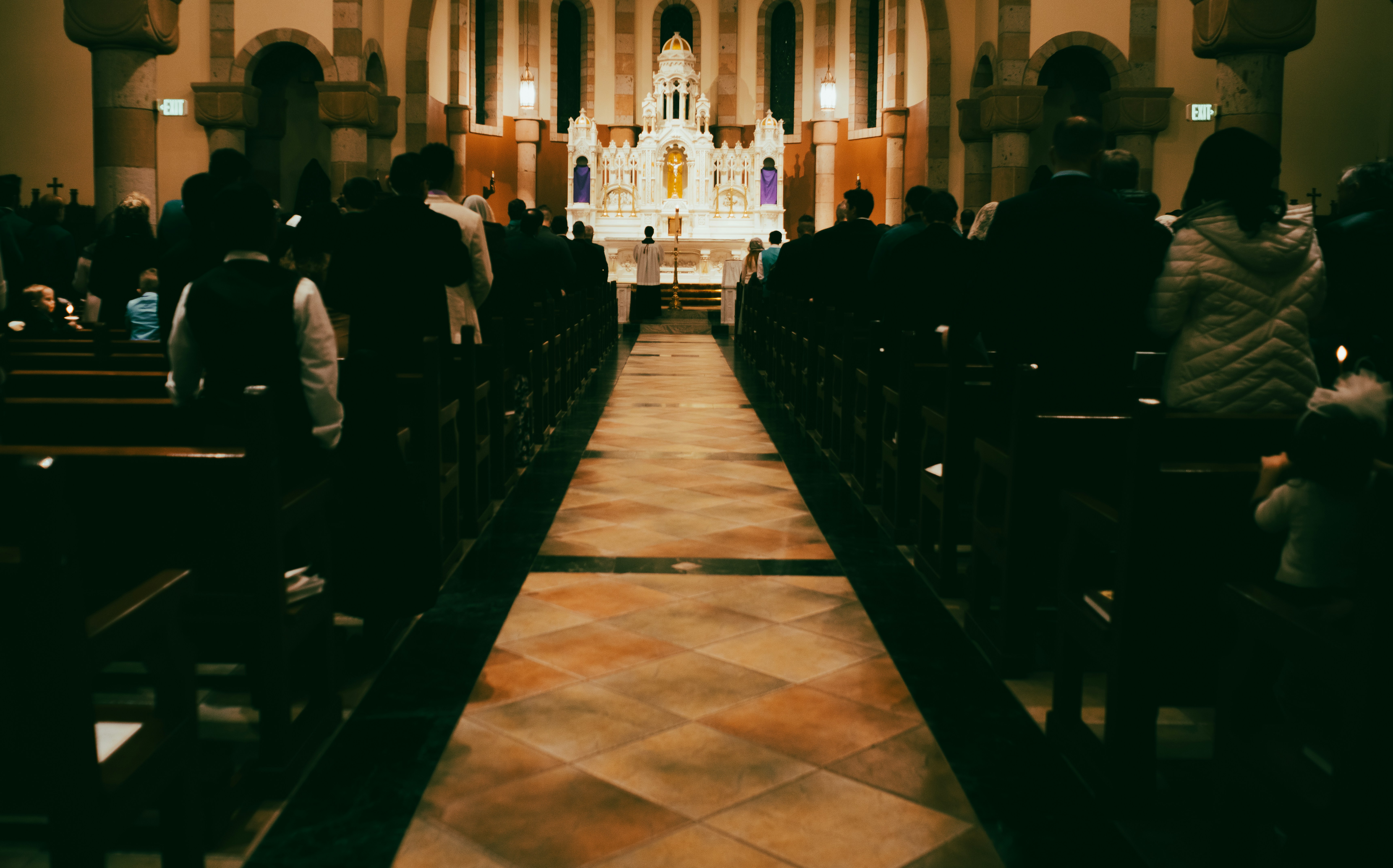 a group of people sitting in a church