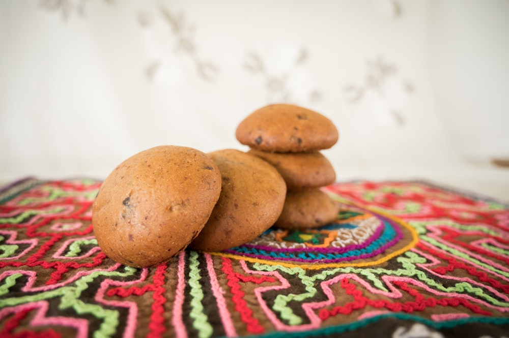 a group of brown objects on a colorful surface