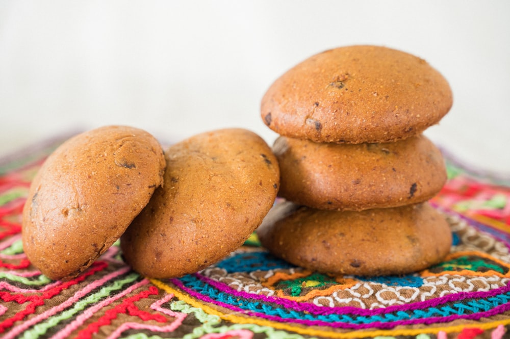 a group of brown round objects on a colorful surface