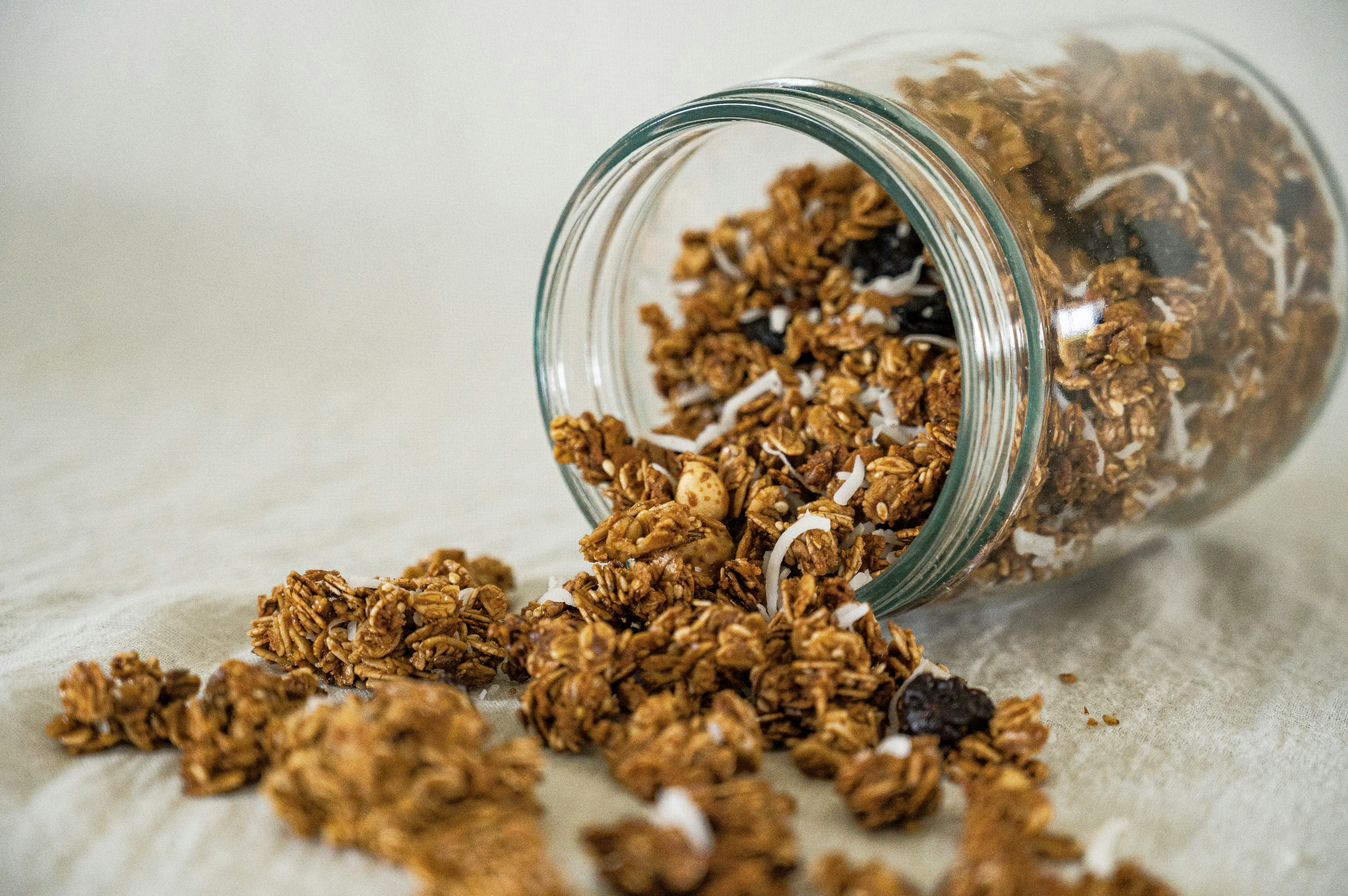 a glass bowl full of dried brown and white grains