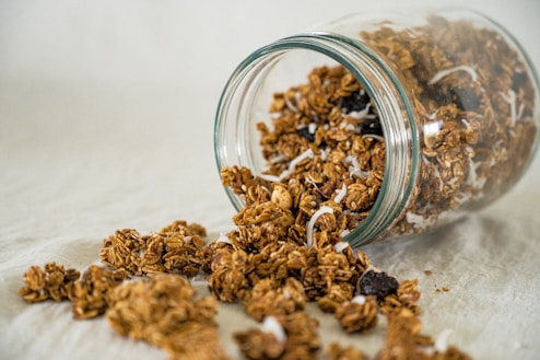a glass bowl full of dried brown and white grains