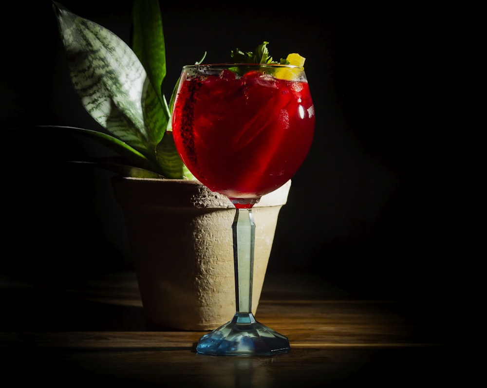 a red rose in a glass vase