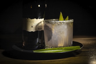 A close-up of a beautifully garnished drink on the bar counter.