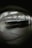 A blurred image depicting a large number of shopping carts lined up under bright fluorescent lights in a structured setting, possibly a warehouse or a storage area. The background and foreground are out of focus, creating a distorted effect.