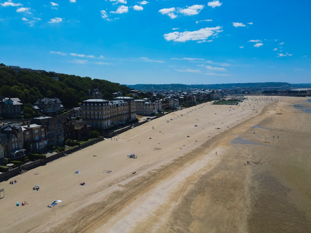 a sandy beach with buildings on it