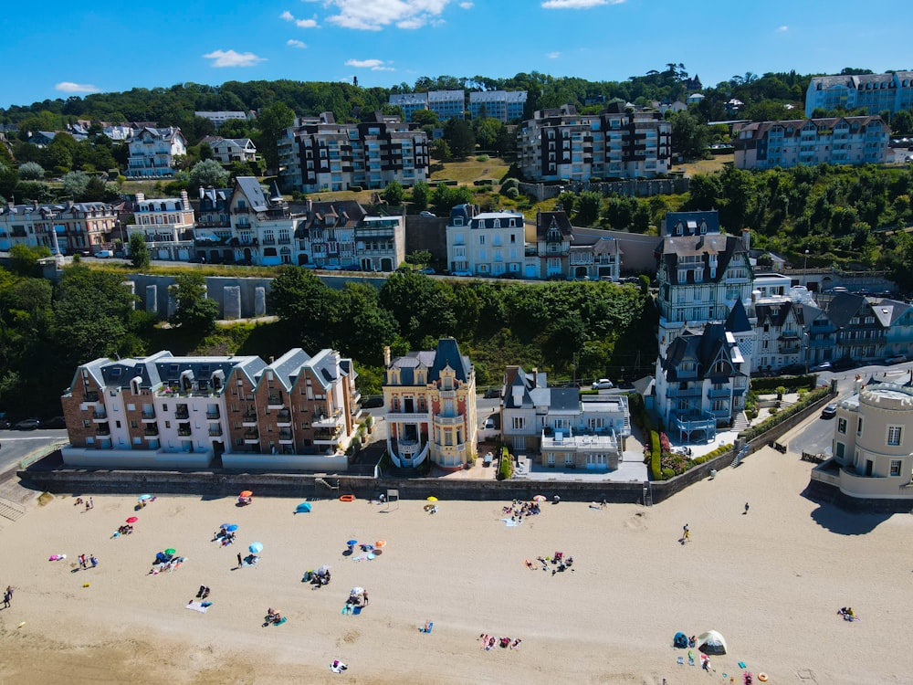 a beach with many buildings and trees