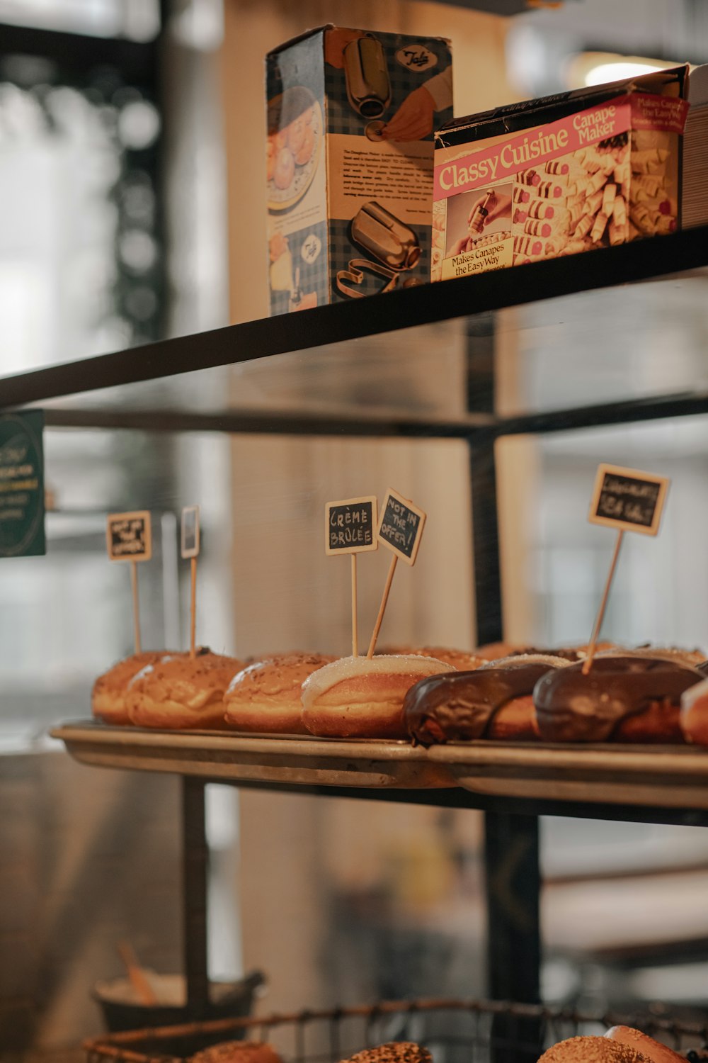 a shelf is filled with donuts