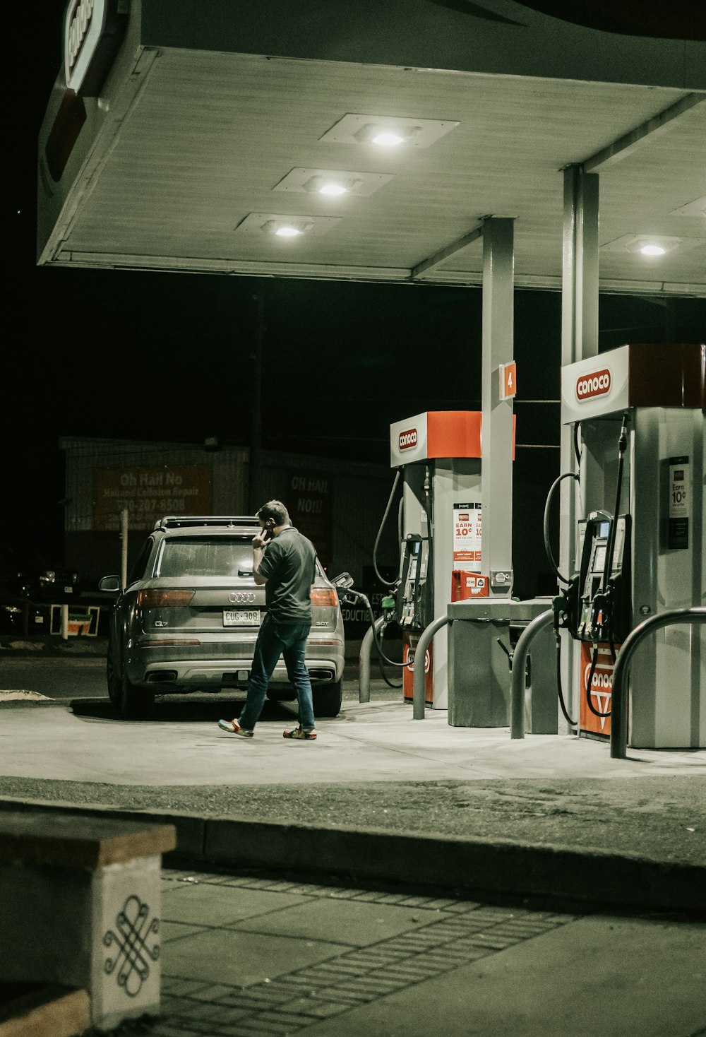 a person walking in a gas station