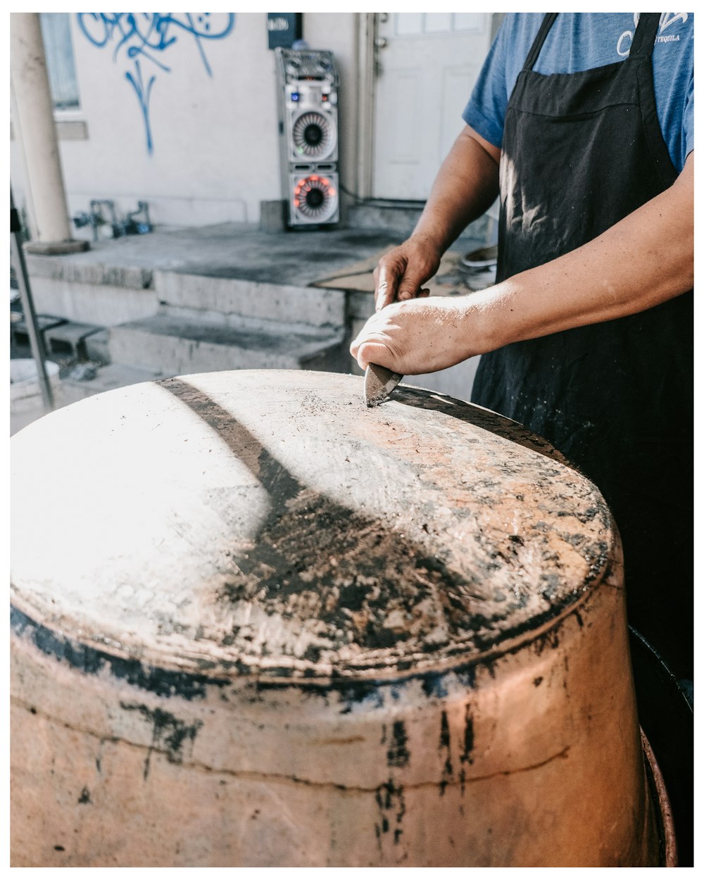 a man cutting a large piece of wood