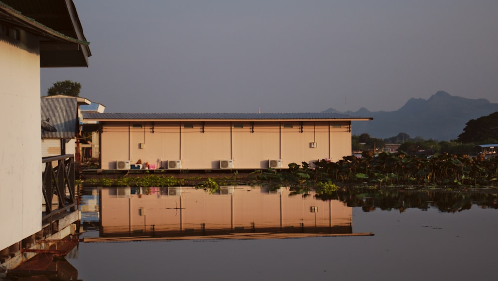 a building next to a body of water