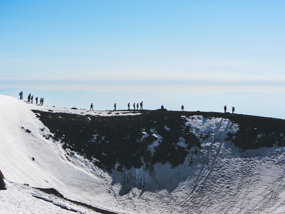 a group of people on a snowy hill