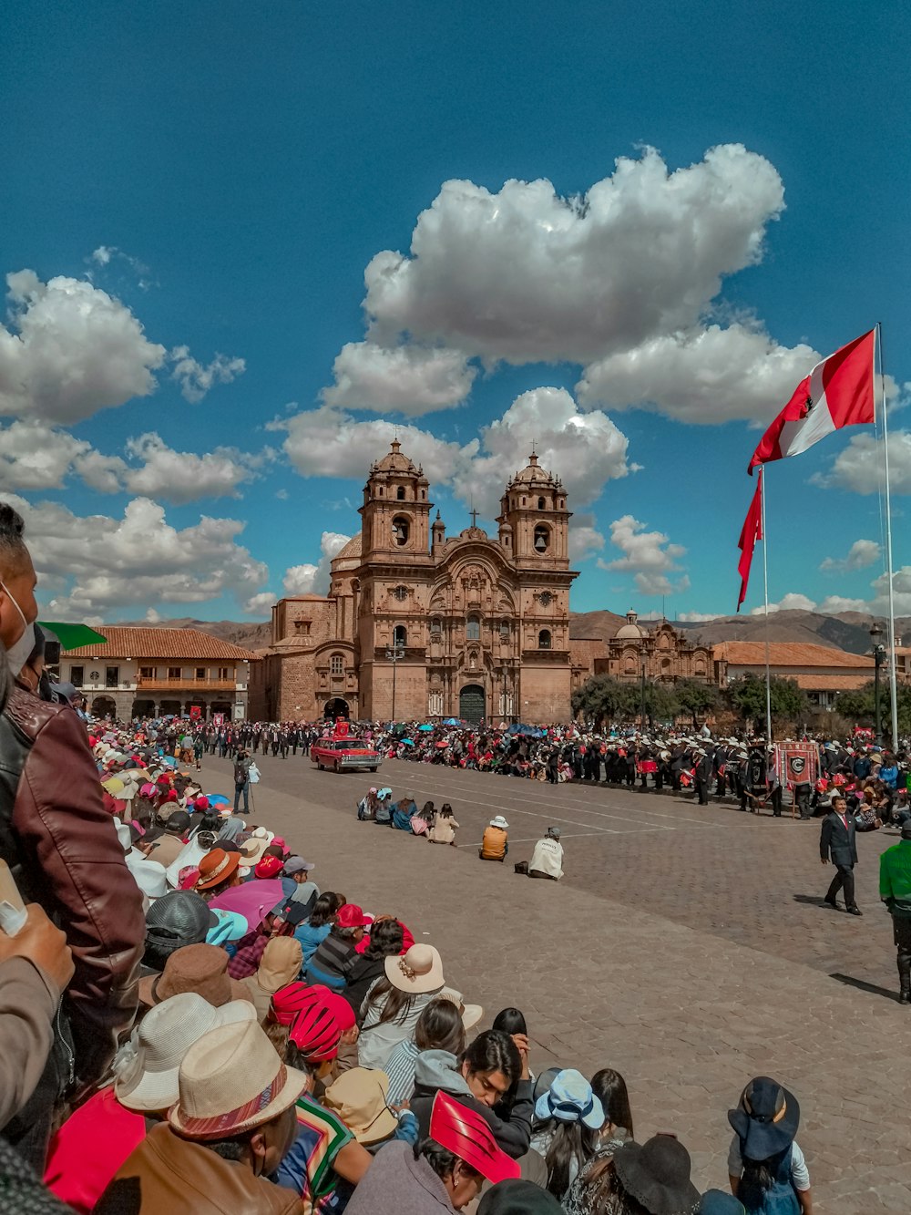 a large crowd of people outside a castle