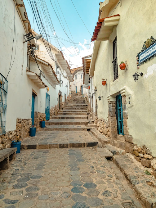 a stone street with buildings on either side of it