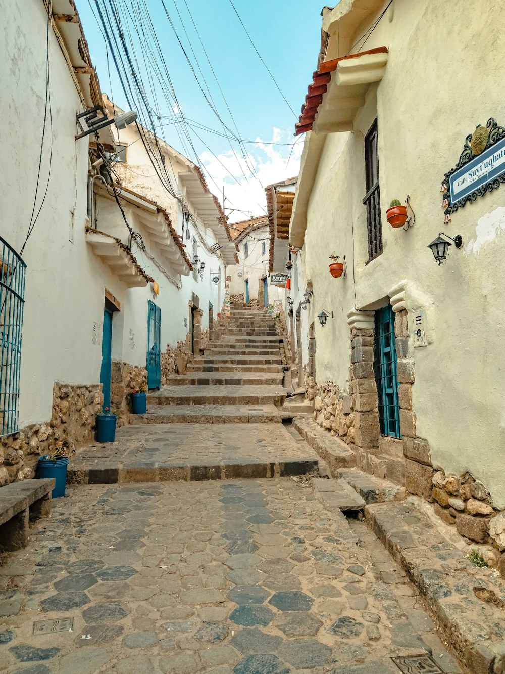 a stone street with buildings on either side of it