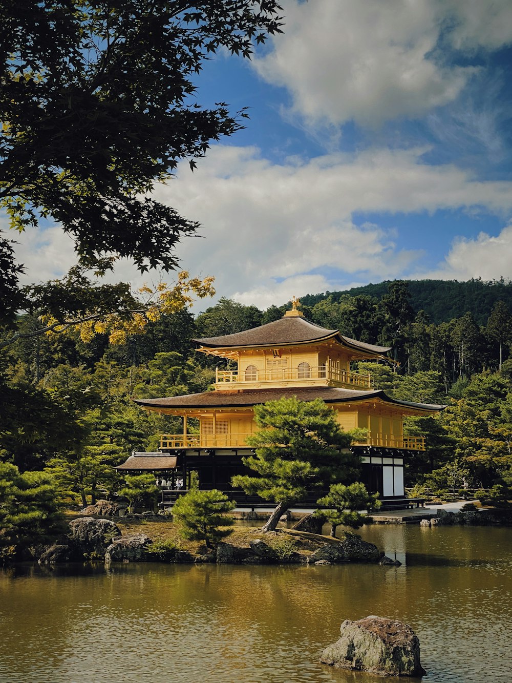 Kinkaku-ji on a hill by a body of water