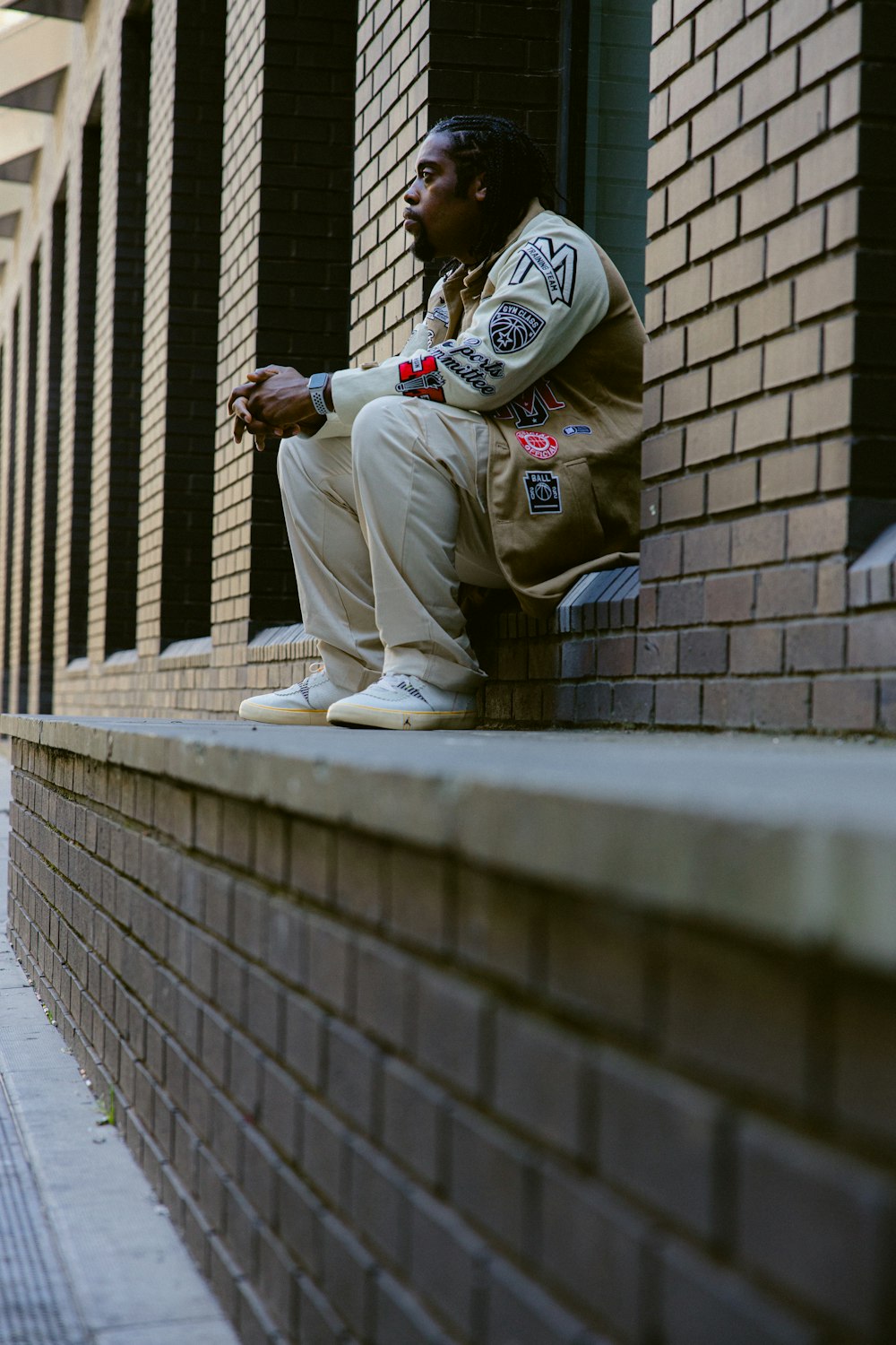 a man sitting on a ledge