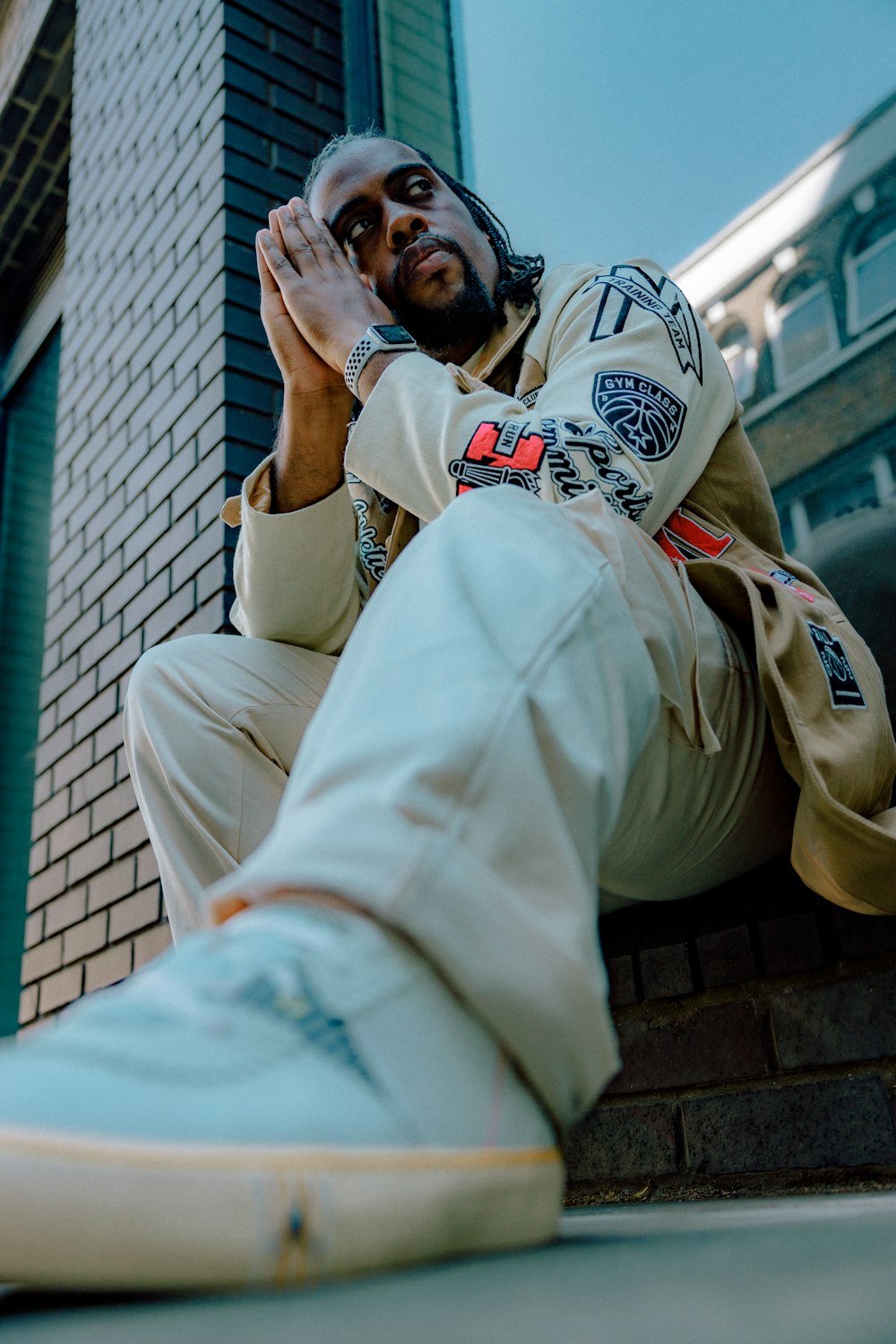 a person sitting on a ledge