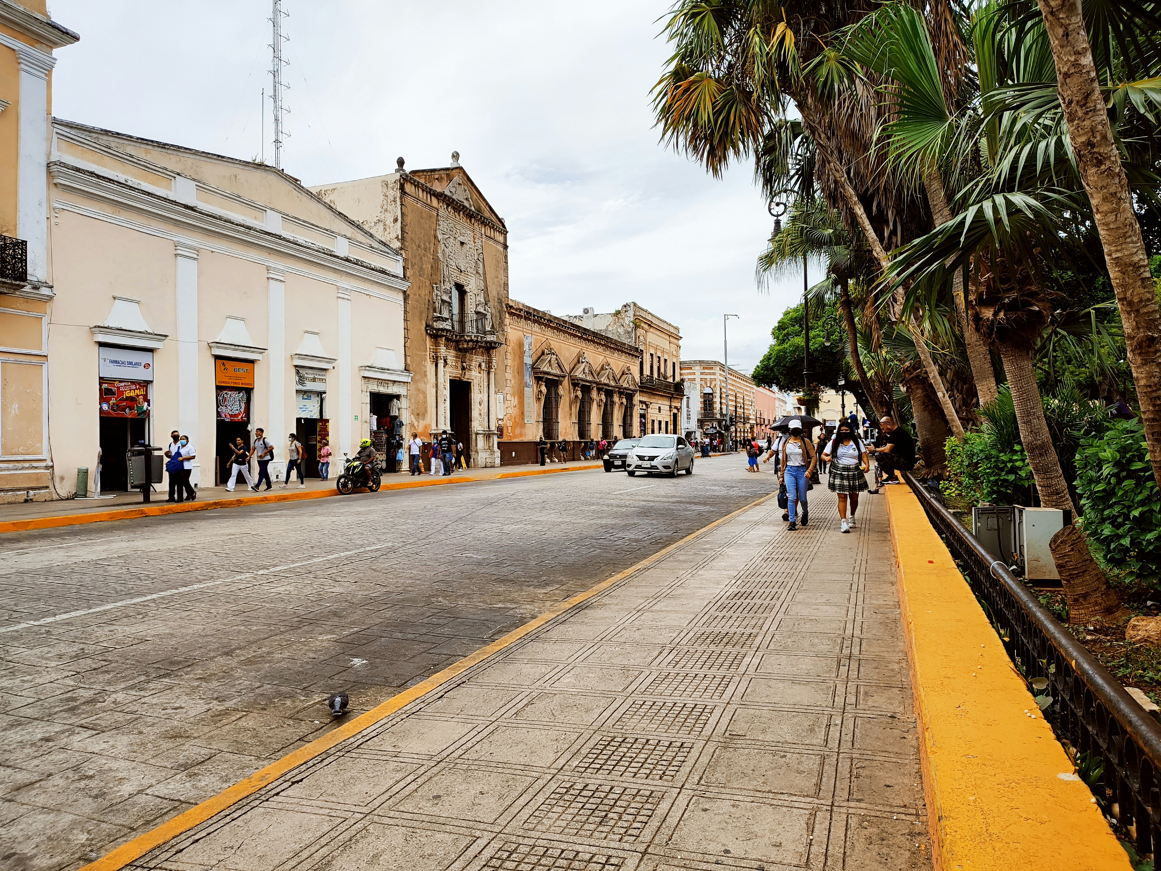 a street with people and cars