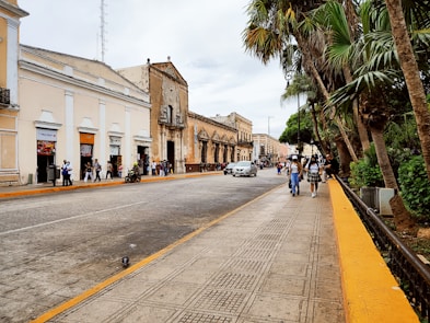 a street with people and cars