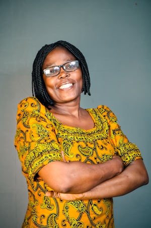 a man wearing a yellow shirt and glasses
