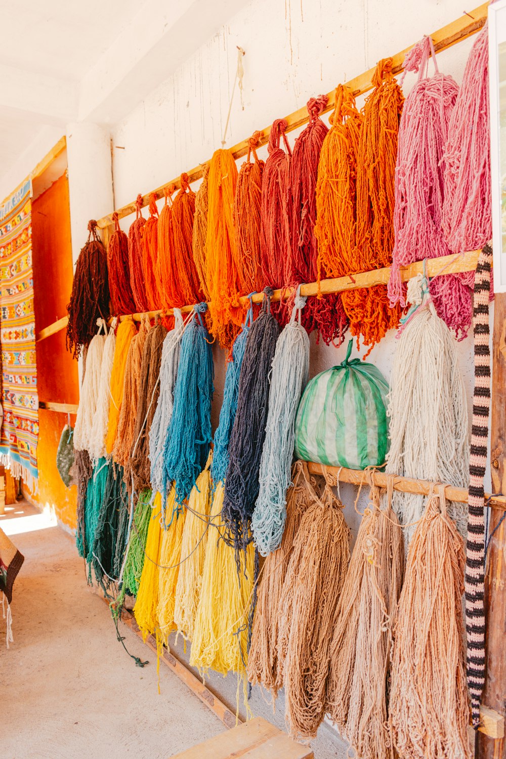 a wall of colorful clothes