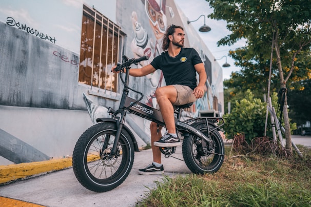 a man sitting on a motorcycle