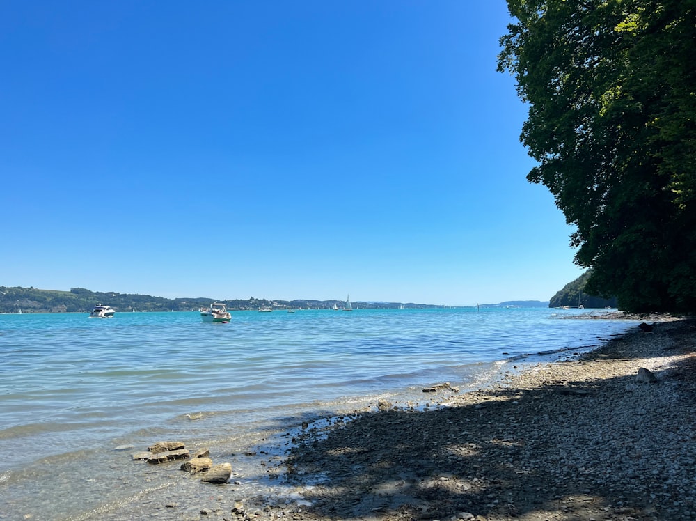 a beach with a boat in the water