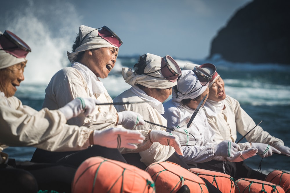 a group of men on a boat