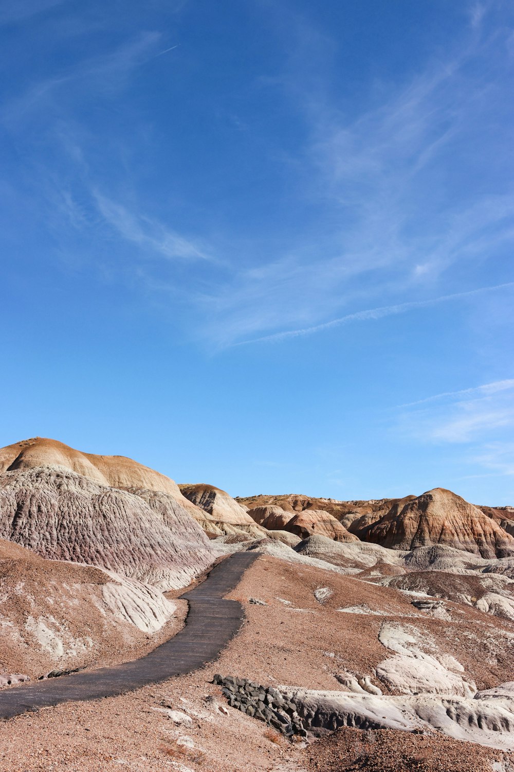 a rocky canyon with a blue sky