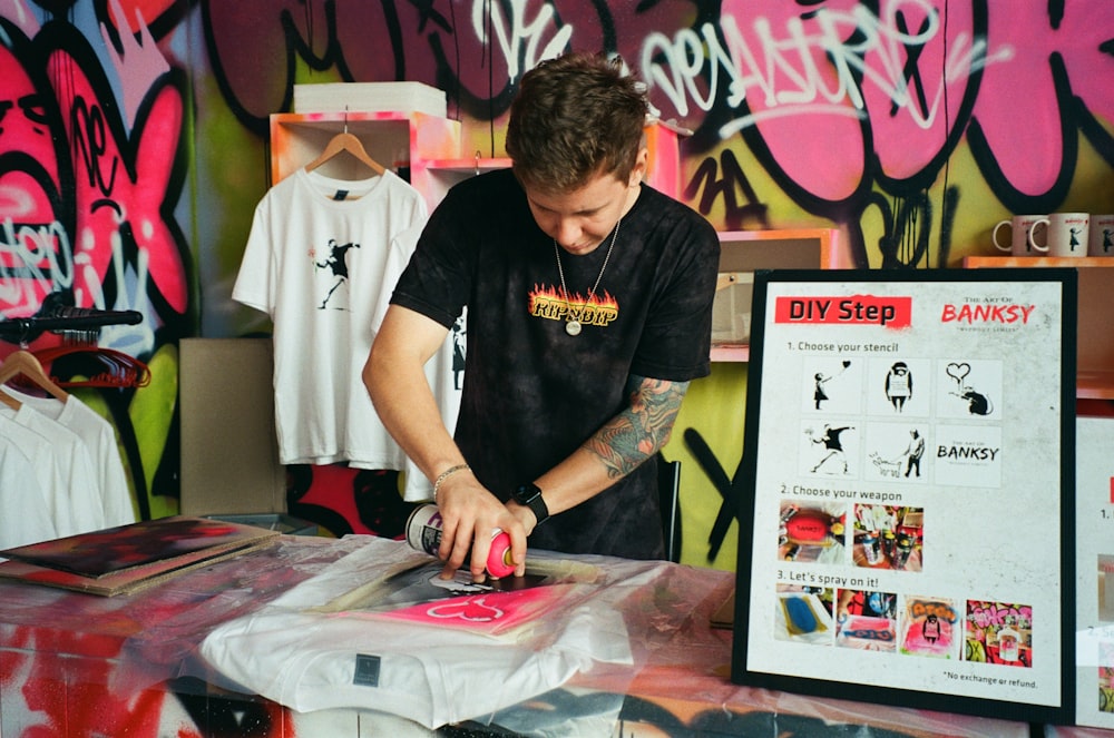 a man cutting a piece of paper