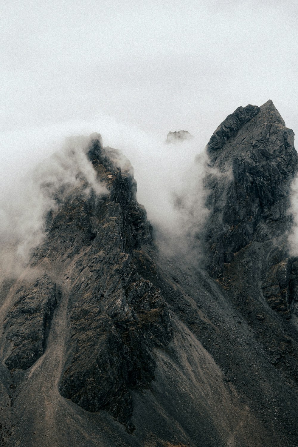 a mountain with clouds
