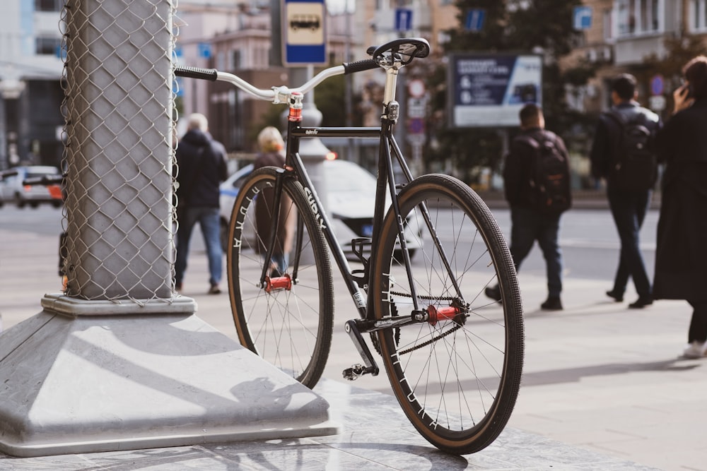 a bicycle parked on a sidewalk