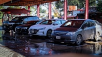 a group of cars parked in a parking lot