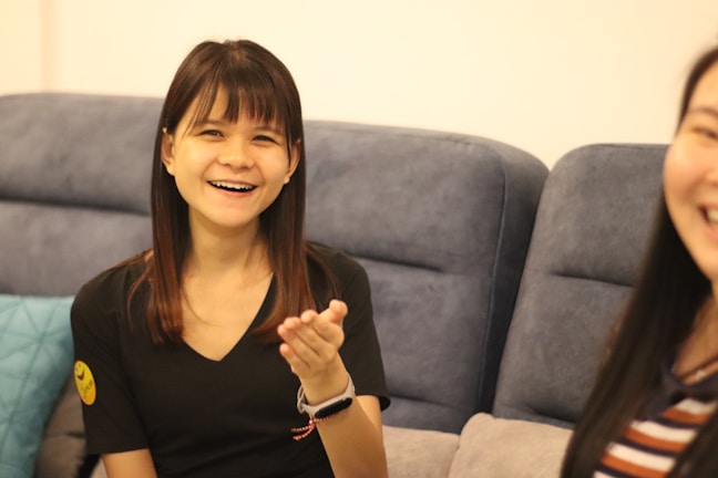 Snapshot of a happy client giving a video testimonial in a cozy setting.