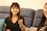 A happy homeowner discussing issues with a friendly contractor in a renovated living room.