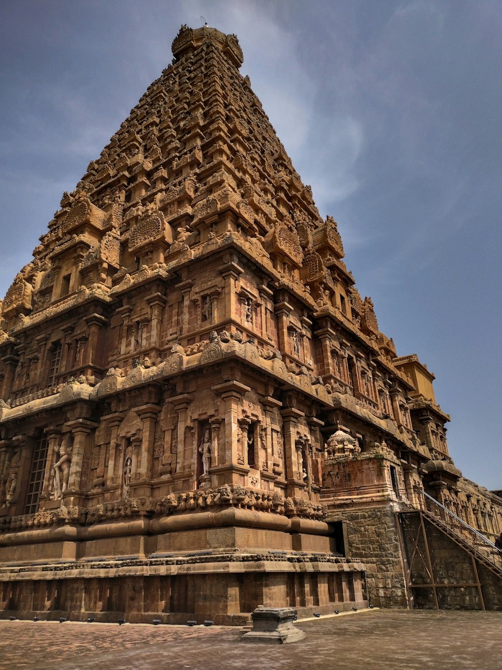 a large stone building with Brihadeeswarar Temple in the background