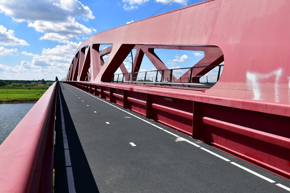 a red bridge with a curved frame