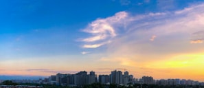 A vibrant photo of a city skyline at sunset, symbolizing the end of a news day