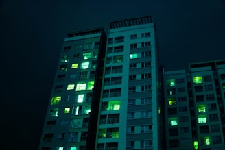 Visual of real-time AI monitoring in a modern apartment building lit with neon green.