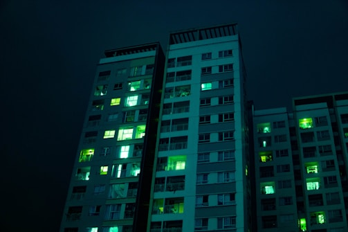 Visual of real-time AI monitoring in a modern apartment building lit with neon green.