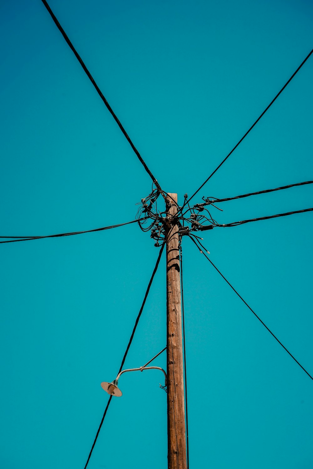 a telephone pole with wires