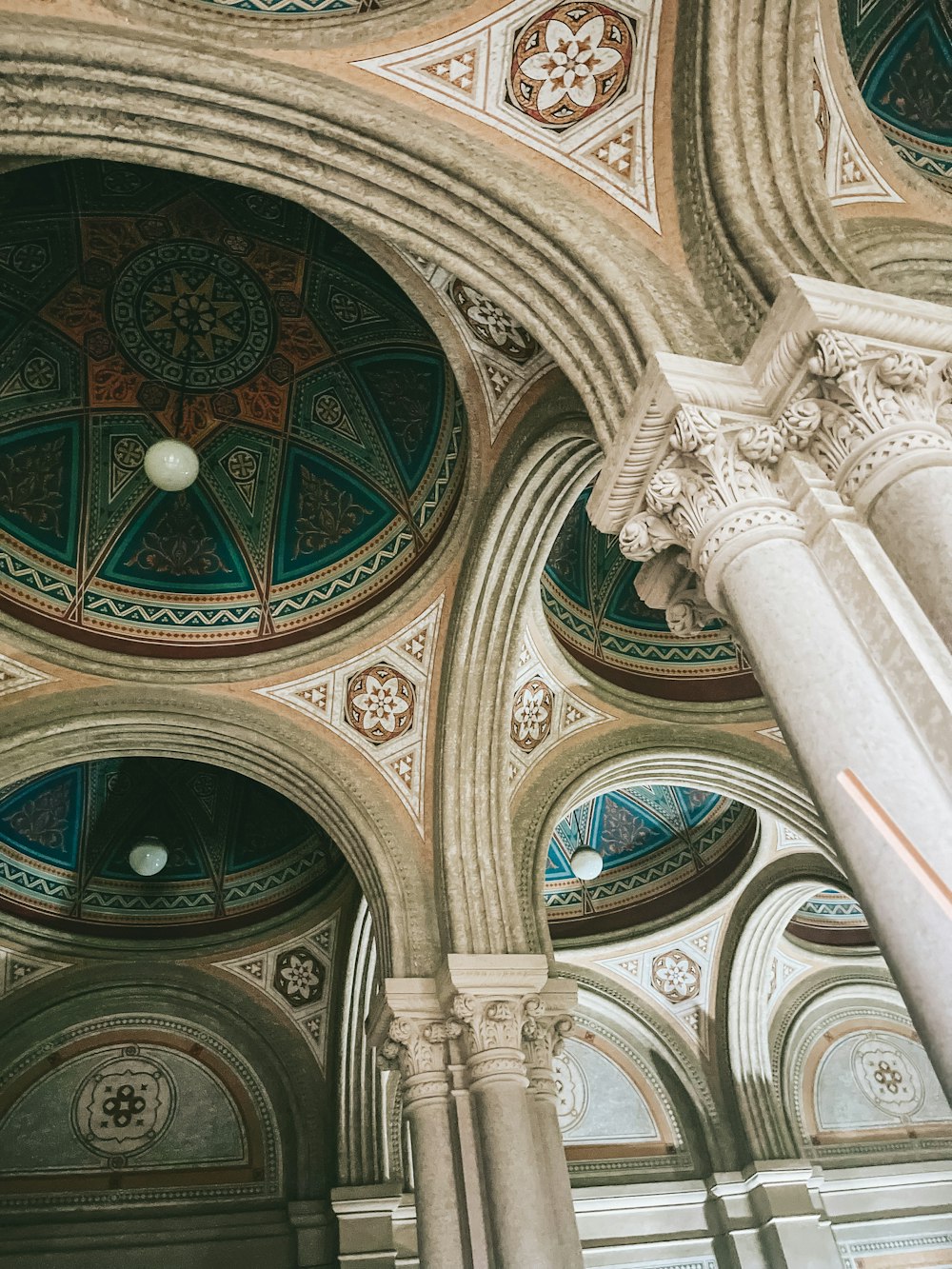 a large ornate ceiling with a large arched ceiling