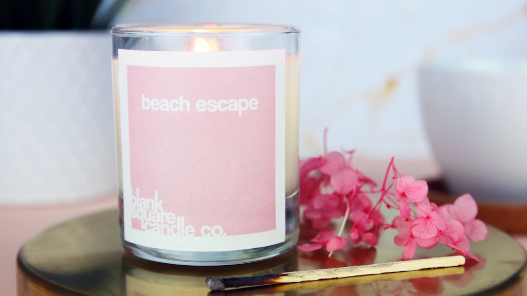a candle in a glass jar, Rectangle paper candle label applied to a glass jar