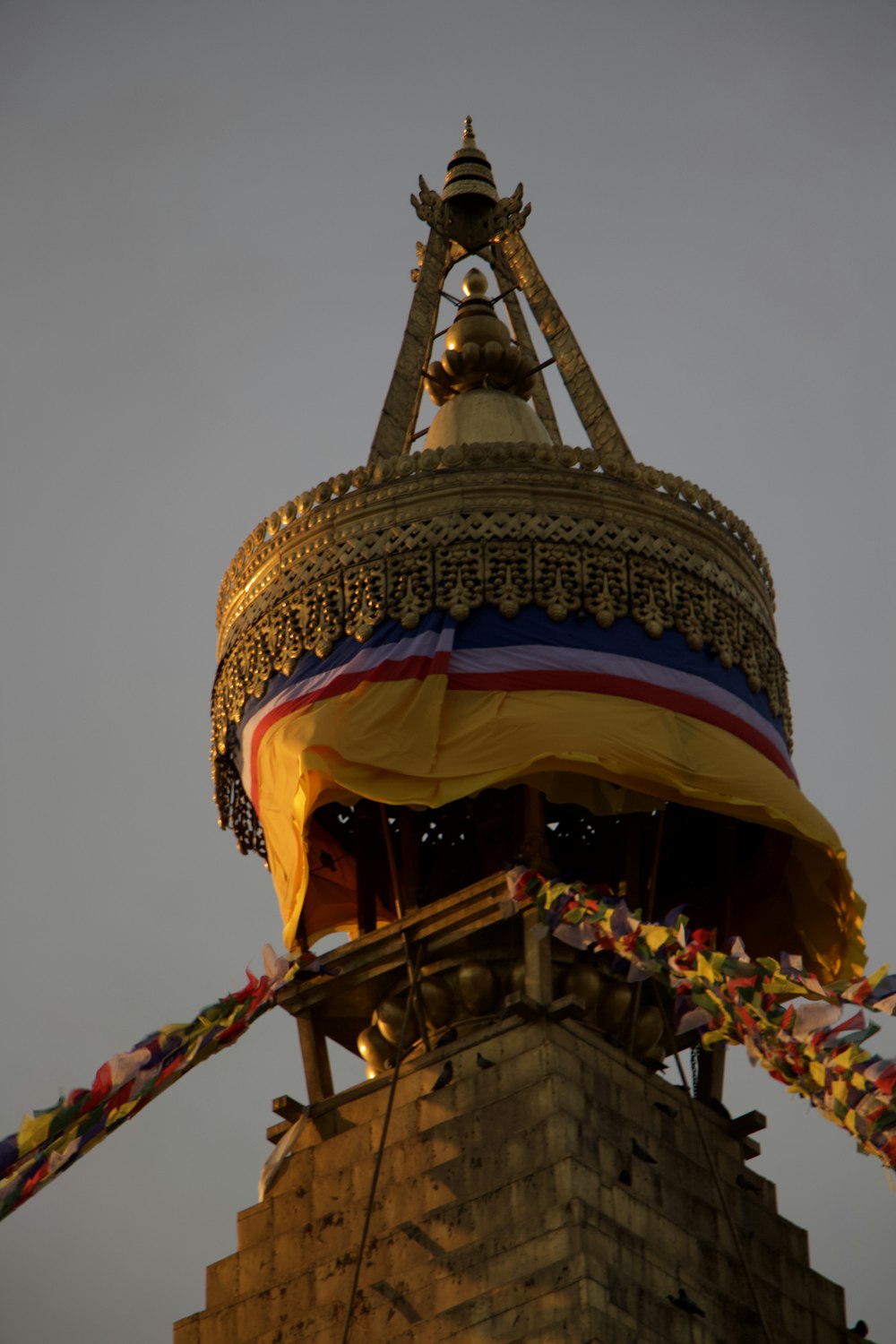 a colorful umbrella on a tower