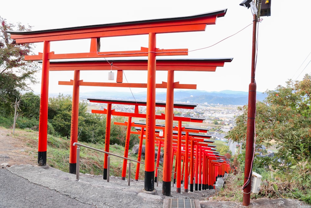 a red gateway with a mountain in the background