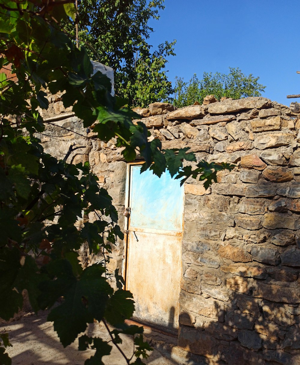 a stone wall with a door