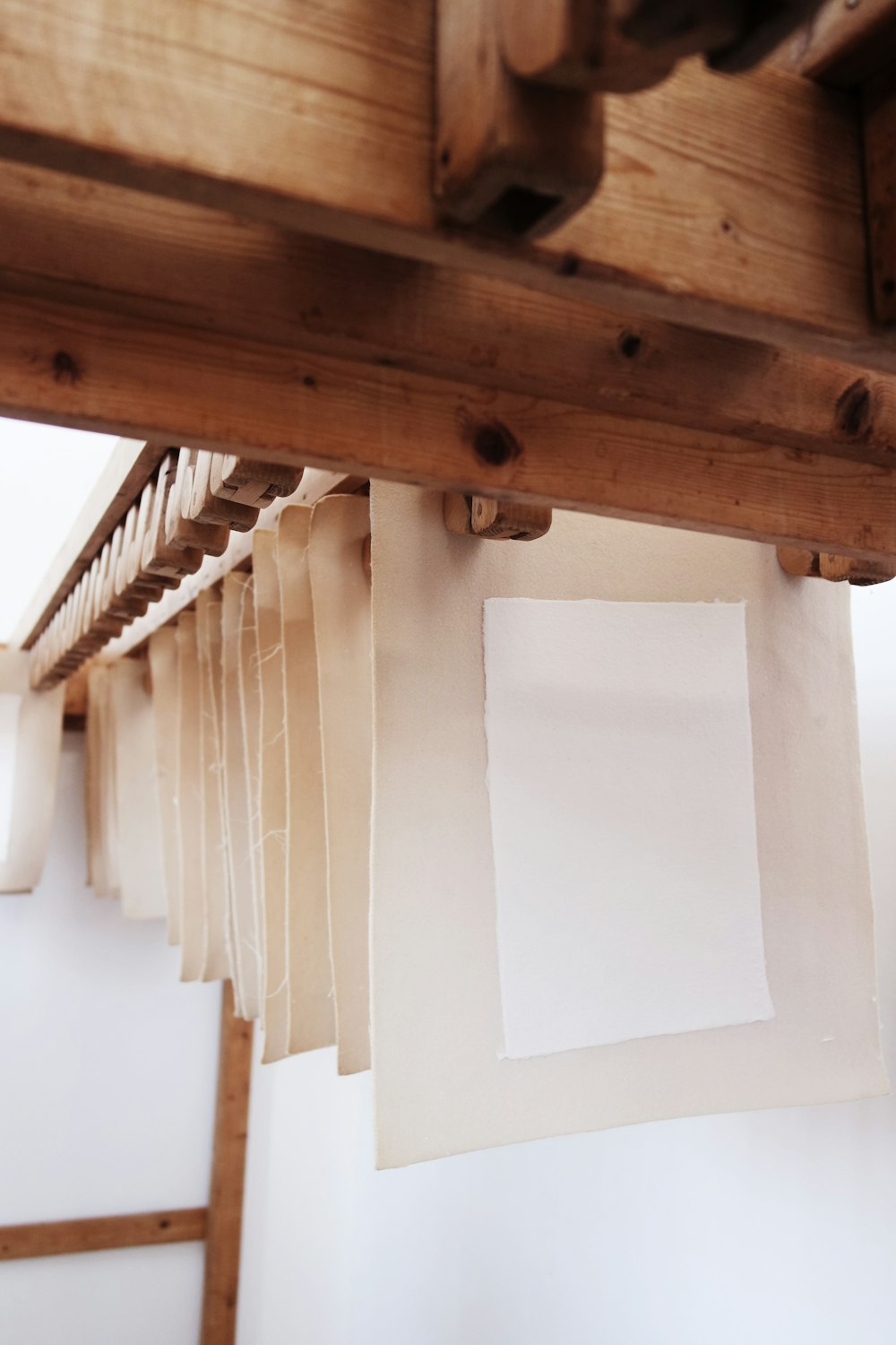 a white board on a wooden ceiling