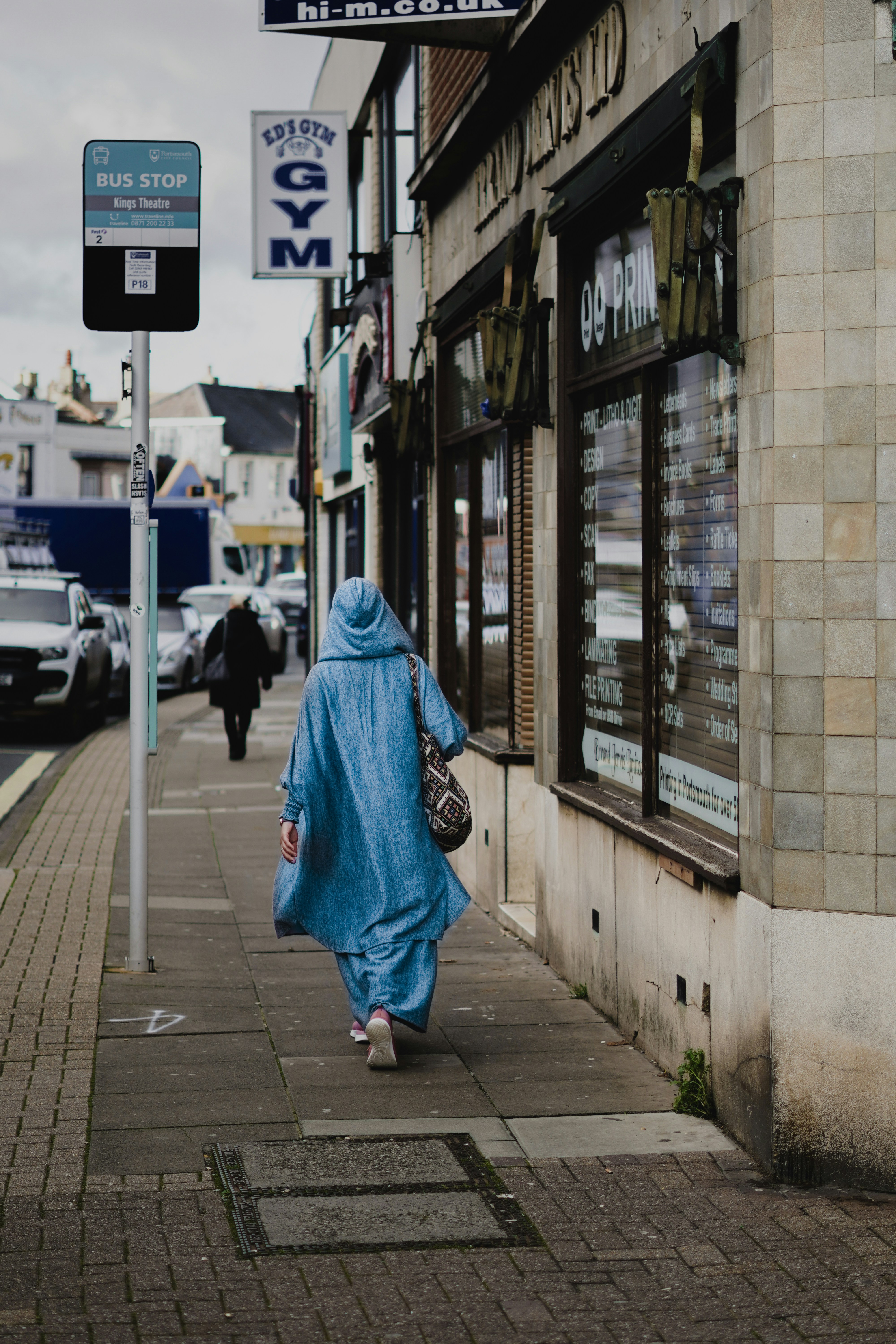 a person walking down a sidewalk