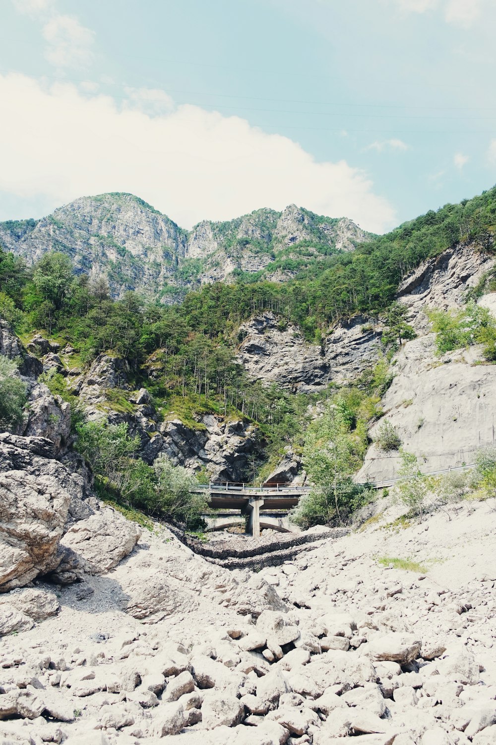 a bridge over a rocky mountain